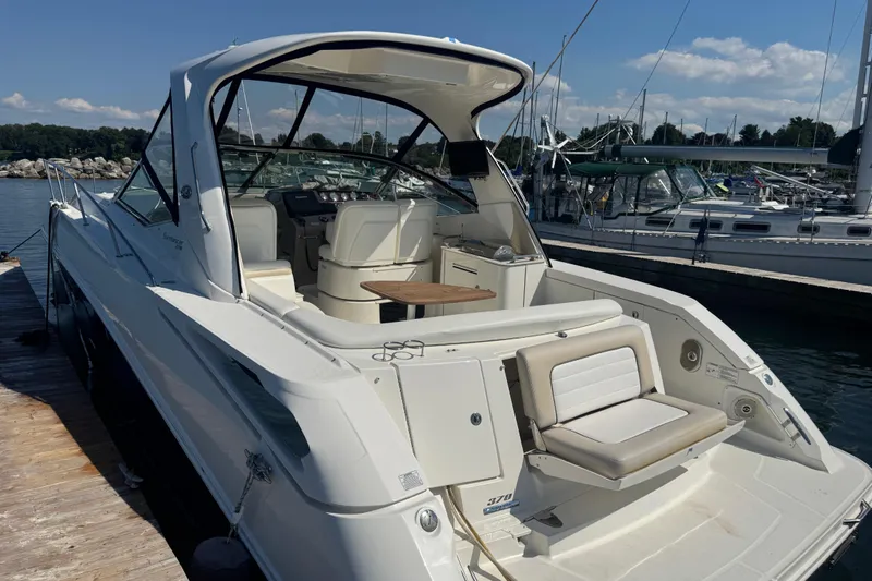  Yacht Photos Pics 2010 Sea Ray 370 Sundancer docked at marina, showcasing spacious cockpit and seating.