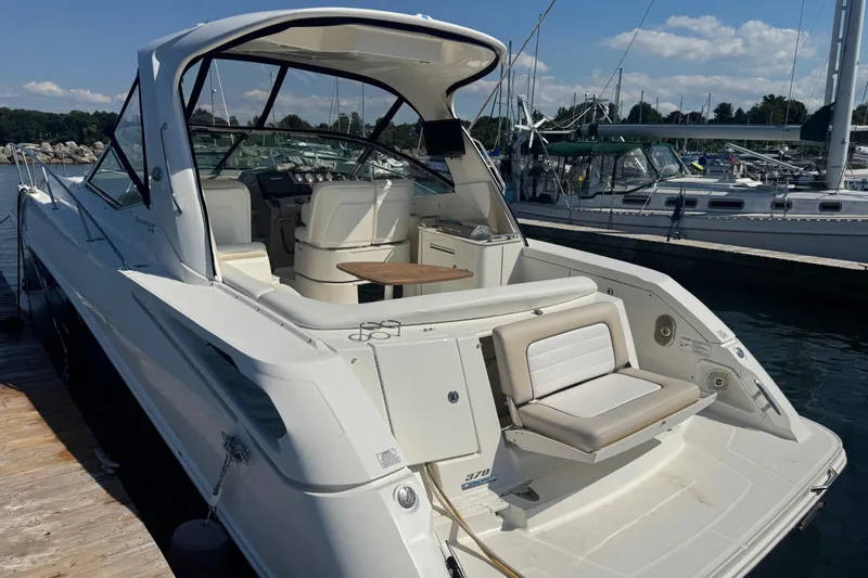  Yacht Photos Pics 2010 Sea Ray 370 Sundancer yacht docked at marina, featuring spacious seating and sleek design.