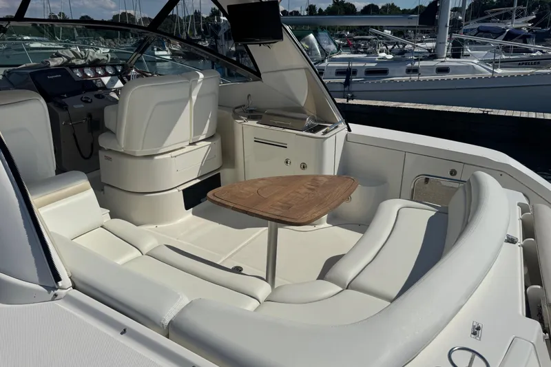  Yacht Photos Pics Luxurious interior of 2010 Sea Ray 370 Sundancer yacht with seating and table.