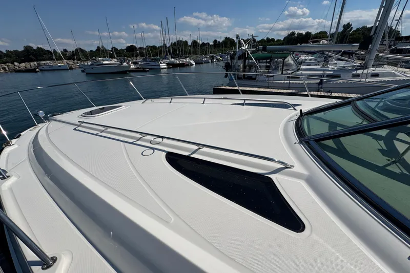  Yacht Photos Pics 2010 Sea Ray 370 Sundancer yacht docked in a marina under a clear blue sky.