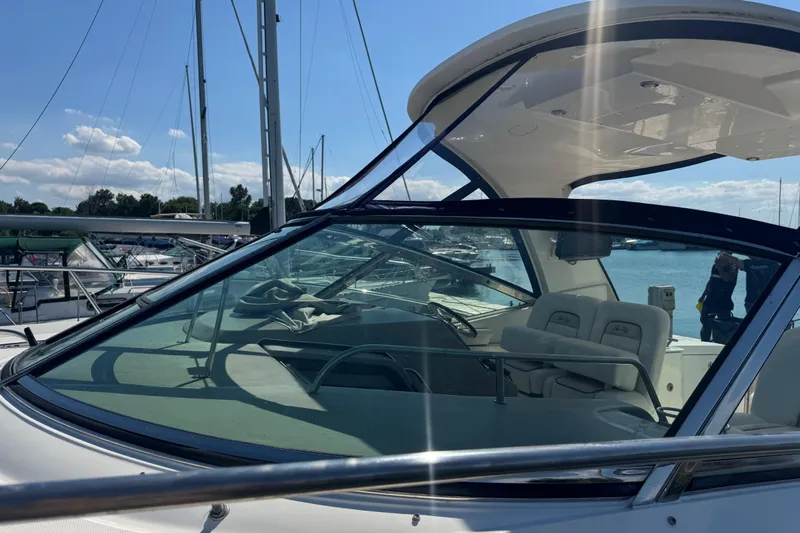  Yacht Photos Pics 2010 Sea Ray 370 Sundancer yacht docked at marina under clear blue sky.