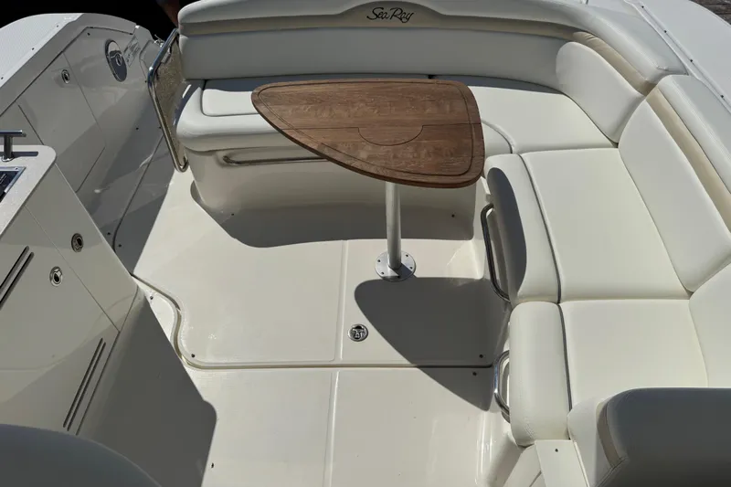  Yacht Photos Pics Luxurious seating area on 2010 Sea Ray 370 Sundancer with wooden table.