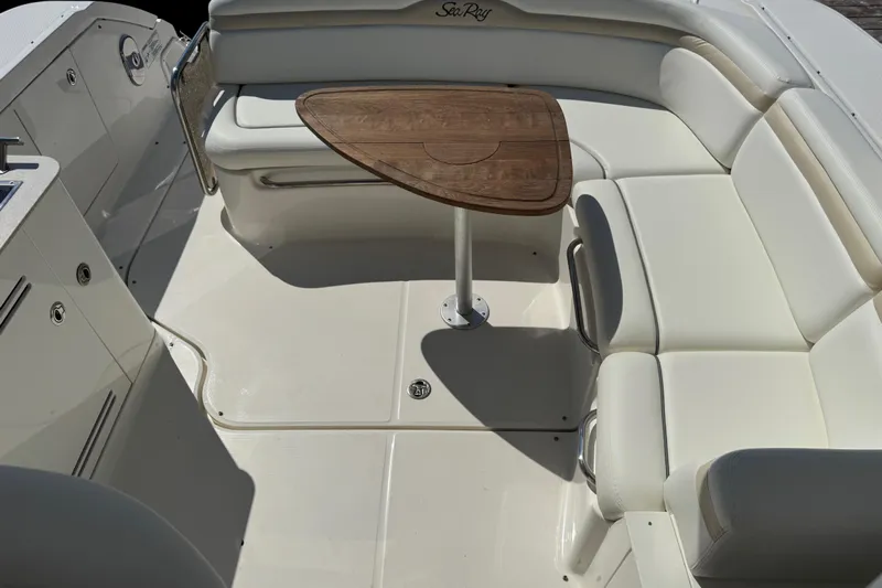  Yacht Photos Pics Luxurious seating area on a 2010 Sea Ray 370 Sundancer yacht with wooden table.