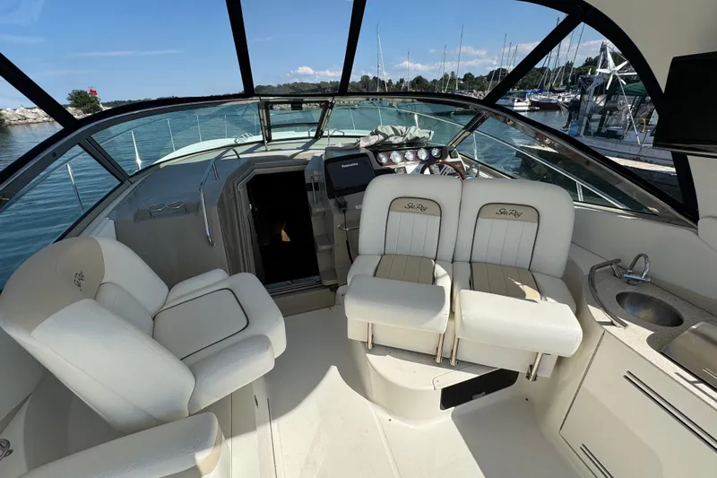  Yacht Photos Pics Interior of 2010 Sea Ray 370 Sundancer yacht with helm and seating area.
