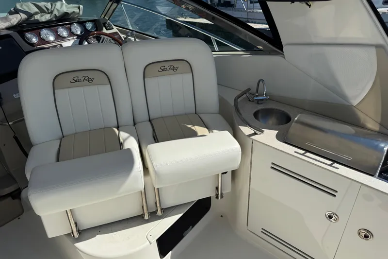  Yacht Photos Pics Interior of 2010 Sea Ray 370 Sundancer with helm seats and wet bar.