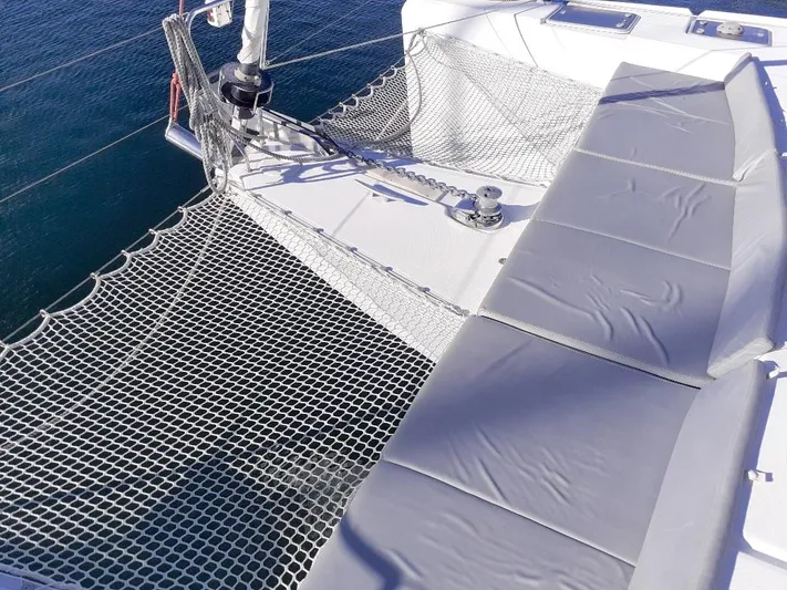 Kirlana Yacht Photos Pics Catamaran deck with netting and cushioned seating, Lagoon 420, 2006 model.