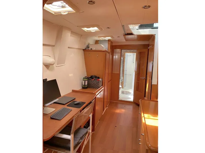 Kirlana Yacht Photos Pics Interior of 2006 Lagoon 420 yacht with wooden furnishings and workspace.