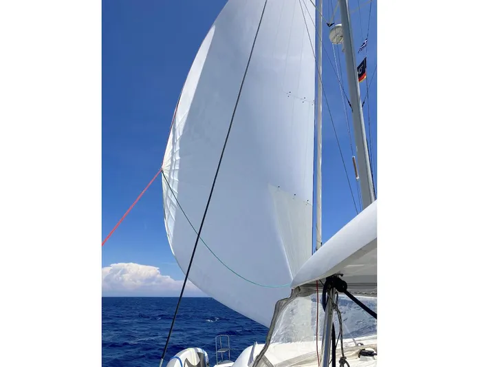 Kirlana Yacht Photos Pics Sailing on a 2006 Lagoon 420 catamaran with full sails against a clear blue sky.