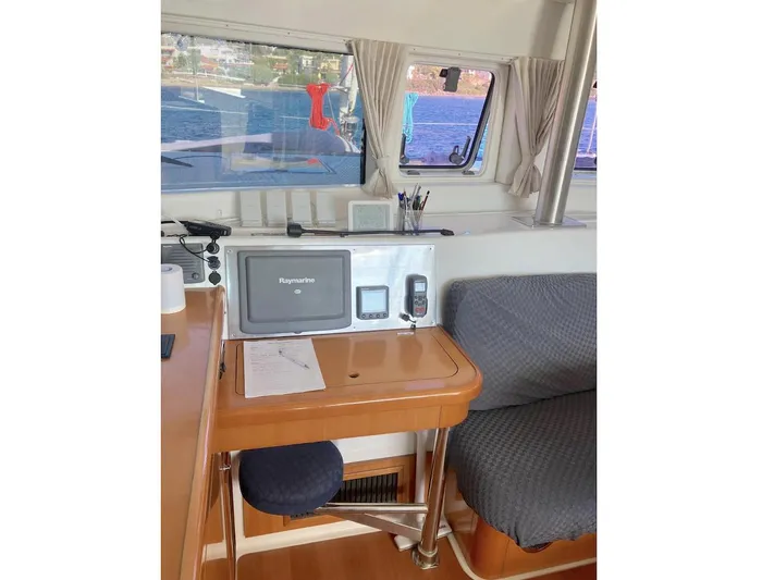 Kirlana Yacht Photos Pics Interior of 2006 Lagoon 420 yacht with navigation equipment and seating area.