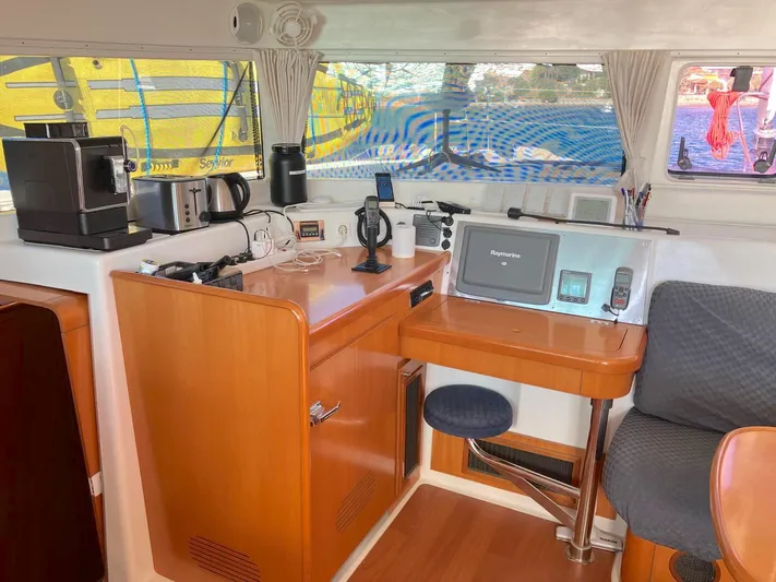 Kirlana Yacht Photos Pics Interior of 2006 Lagoon 420 yacht with navigation equipment and kitchen appliances.