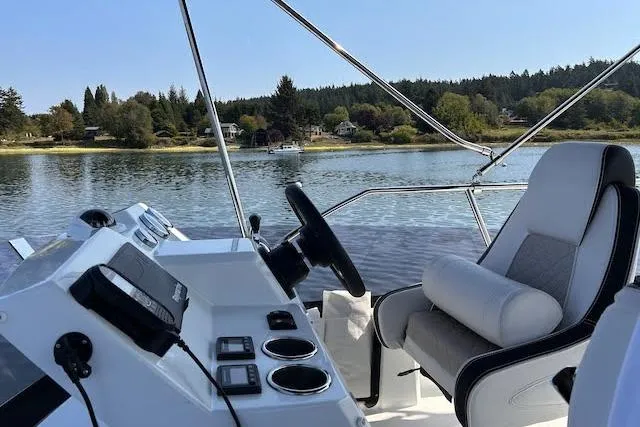  Yacht Photos Pics 2018 Jeanneau Velasco 37F boat helm with scenic lake view.