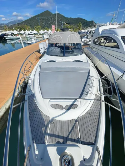  Yacht Photos Pics 2007 Cranchi Endurance 41 yacht docked at marina with scenic mountain backdrop.