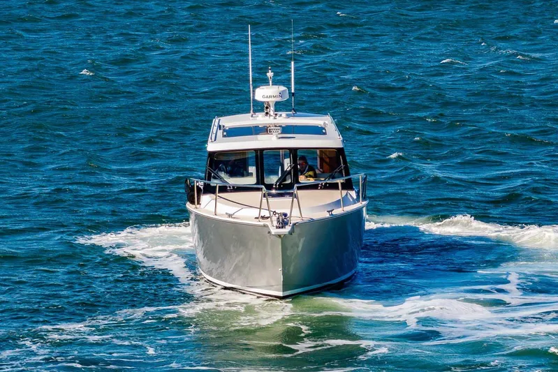  Yacht Photos Pics 2020 Coastal Craft 33 Express cruising on open water.