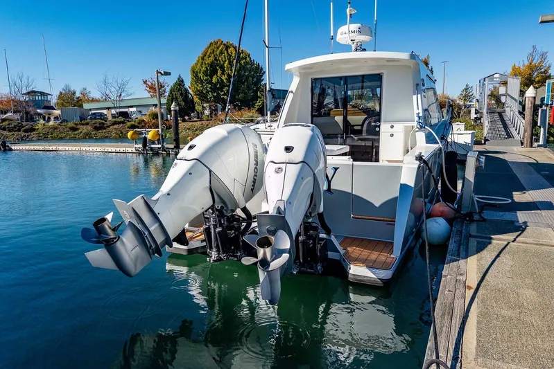  Yacht Photos Pics 2020 Coastal Craft 33 Express docked with dual outboard engines.