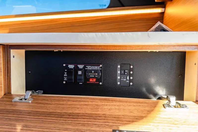 Yacht Photos Pics Control panel inside 2020 Coastal Craft 33 Express boat, featuring switches and indicators.