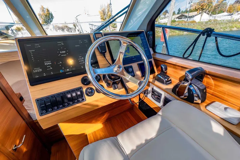  Yacht Photos Pics 2020 Coastal Craft 33 Express helm with modern navigation and control systems.