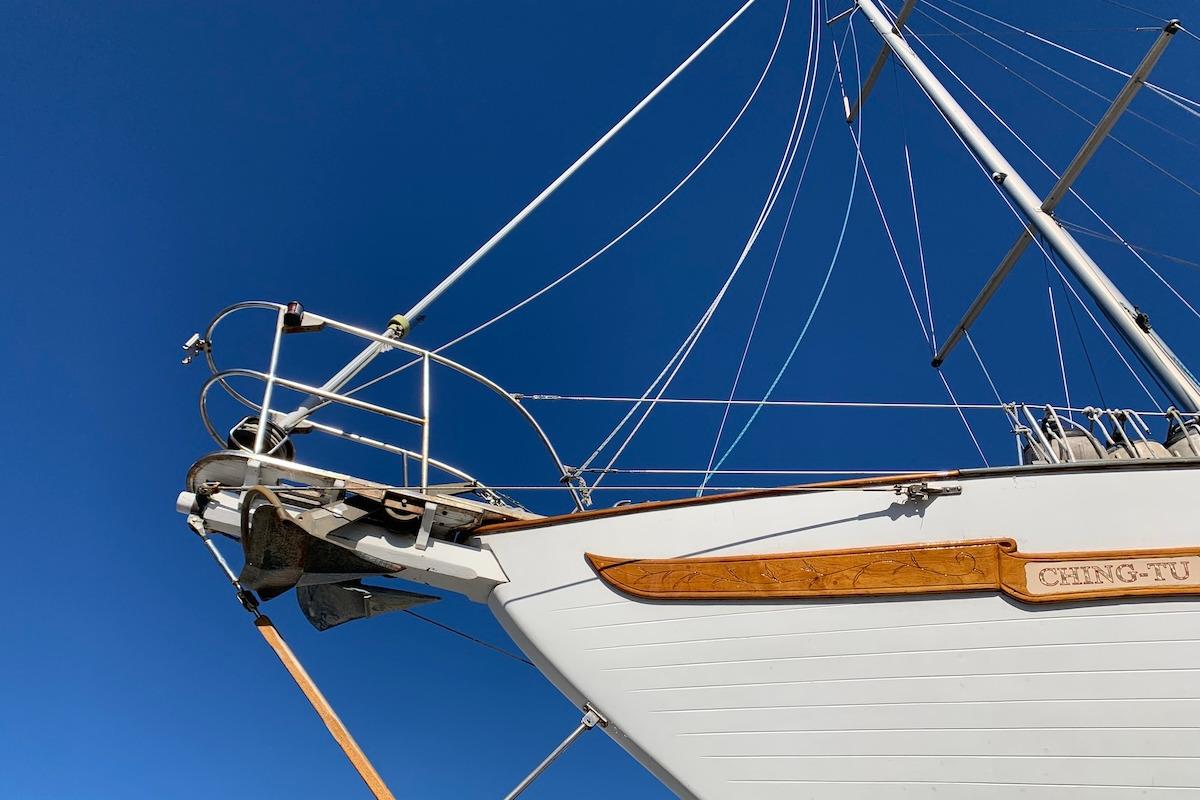 Bow of 1981 Hardin 45 sailboat against clear blue sky.