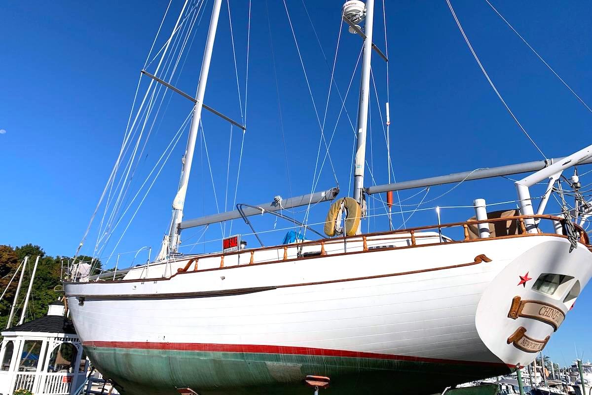 1981 Hardin 45 sailboat docked, showcasing its classic design and tall masts against a clear blue sky.