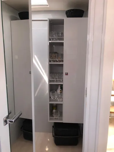  Yacht Photos Pics Cabinet with glassware and baskets inside a 2016 Fjord Open 48 yacht.