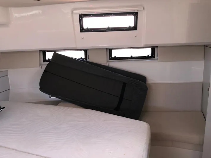  Yacht Photos Pics Cabin interior of 2016 Fjord Open 48 yacht with windows and seating.