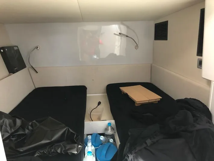  Yacht Photos Pics Cabin interior of 2016 Fjord Open 48 yacht with twin beds and reading lights.