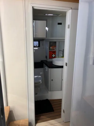  Yacht Photos Pics 2016 Fjord Open 48 yacht bathroom with modern fixtures and wooden flooring.