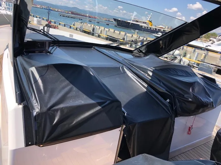  Yacht Photos Pics 2016 Fjord Open 48 yacht with covered deck, docked at a marina.