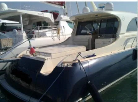  Yacht Photos Pics 2005 Mochi Craft 51 Dolphin yacht docked at marina, rear view.