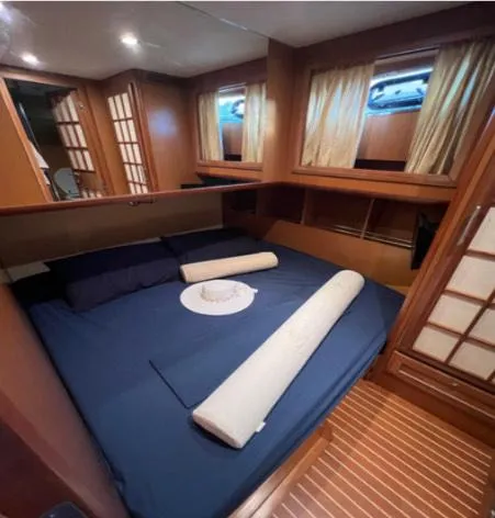  Yacht Photos Pics Luxurious cabin interior of 2005 Mochi Craft 51 Dolphin yacht with cozy bedding.