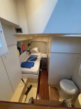  Yacht Photos Pics 2005 Mochi Craft 51 Dolphin cabin interior with bed and toilet.