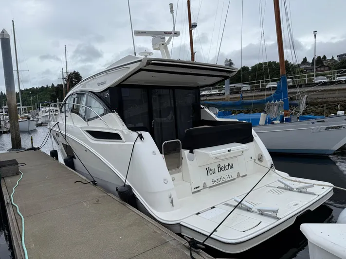 You Betcha Yacht Photos Pics 2016 Sea Ray 400 Sundancer yacht docked at marina, rear view.