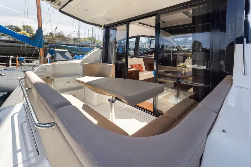You Betcha Yacht Photos Pics 2016 Sea Ray 400 Sundancer yacht with elegant outdoor seating and table.