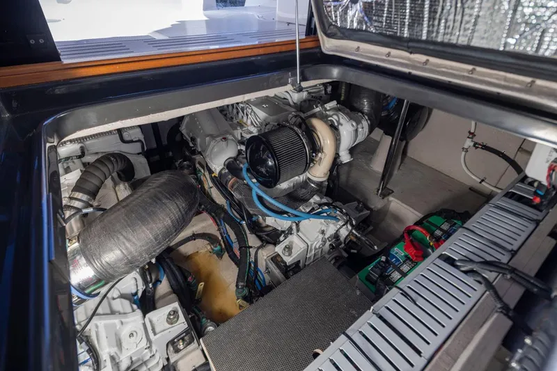 You Betcha Yacht Photos Pics Engine compartment of a 2016 Sea Ray 400 Sundancer yacht, showcasing mechanical components.