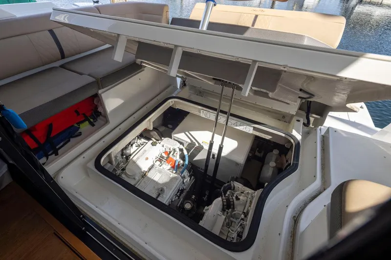 You Betcha Yacht Photos Pics Engine compartment of 2016 Sea Ray 400 Sundancer yacht, showcasing mechanical components.