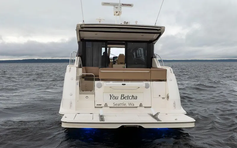 You Betcha Yacht Photos Pics 2016 Sea Ray 400 Sundancer yacht on open water, rear view with "You Betcha" name.