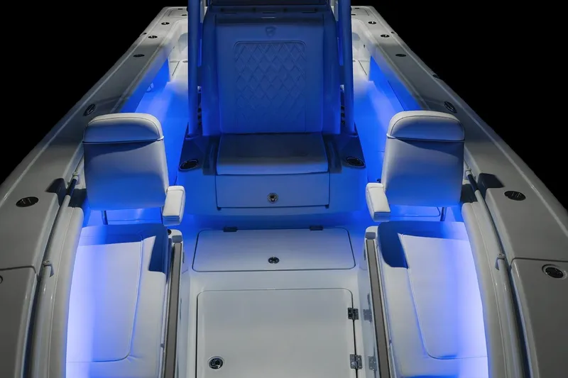  Yacht Photos Pics 2022 Barker Boatworks 26 Open interior with blue LED lighting and cushioned seating.