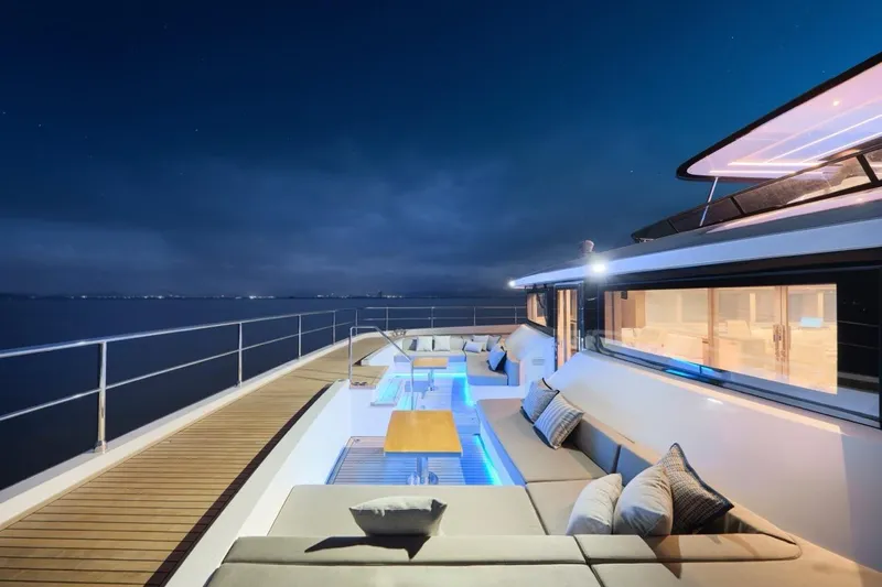 Seaview 75 Yacht Photos Pics Luxurious 2026 Heysea Seaview 75 yacht deck at night, featuring elegant seating and ambient lighting.