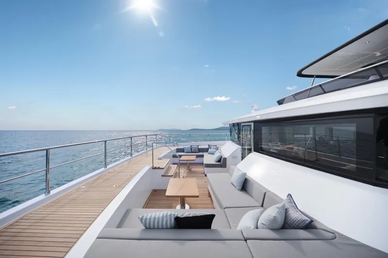 Seaview 75 Yacht Photos Pics Luxurious Heysea Seaview 75 yacht deck with elegant seating, ocean view, and clear blue sky.