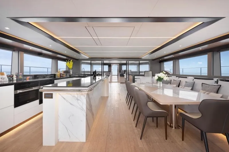 Seaview 75 Yacht Photos Pics Luxurious interior of 2026 Heysea Seaview 75 yacht with modern kitchen and dining area.