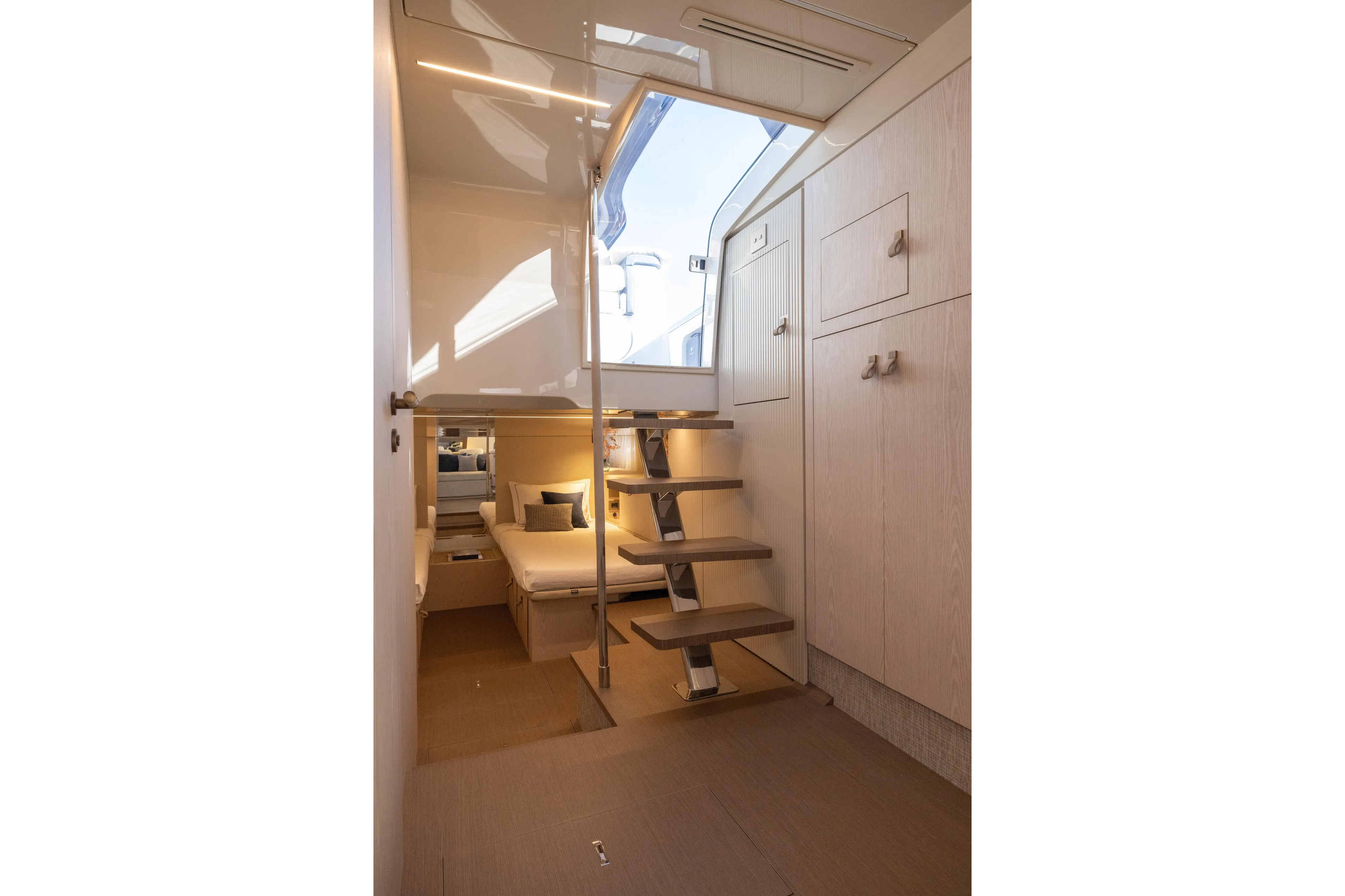  Yacht Photos Pics Luxurious interior of 2026 Invictus TT460 yacht with modern staircase and cozy cabin.