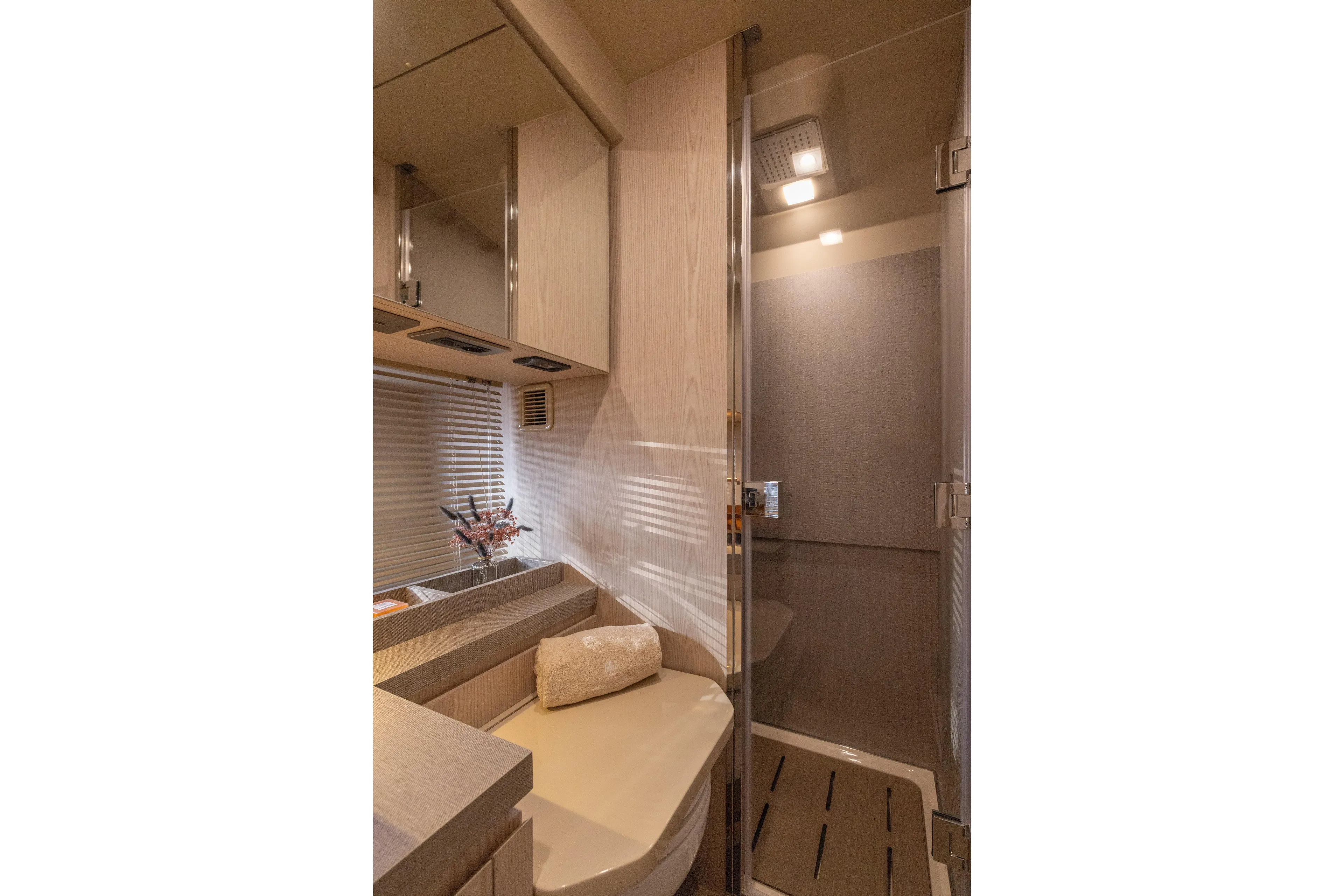  Yacht Photos Pics Luxurious bathroom interior of 2026 Invictus TT460 yacht with modern fixtures and elegant design.