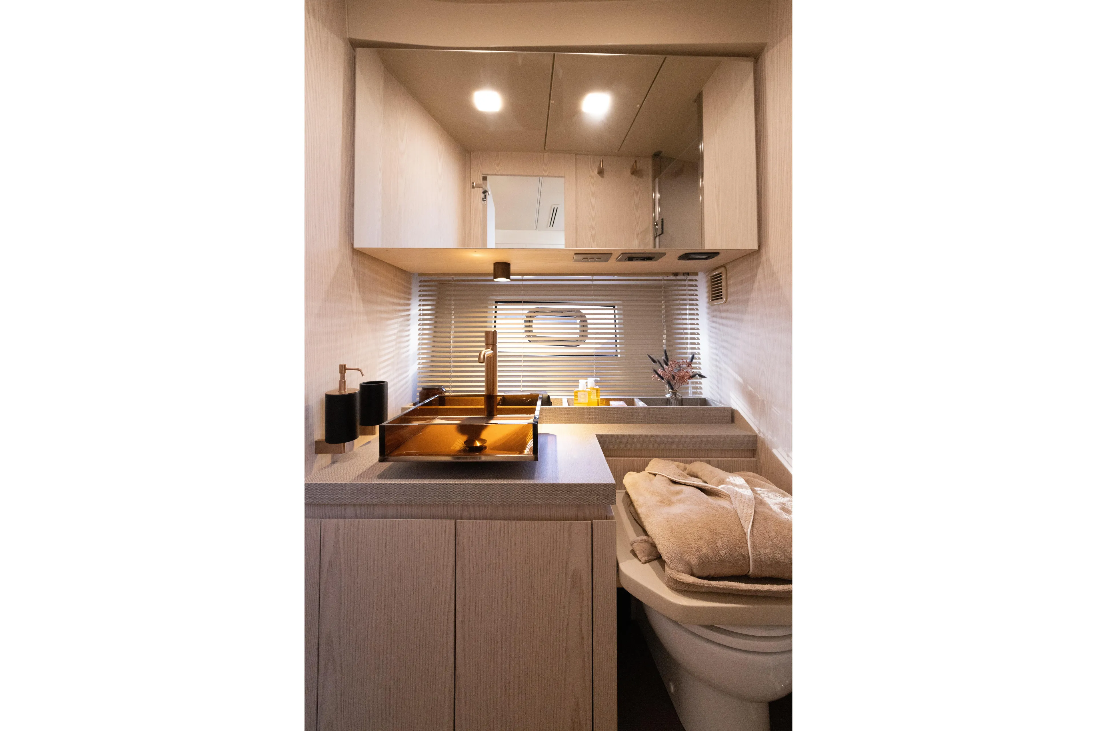  Yacht Photos Pics Luxurious bathroom interior of 2026 Invictus TT460 yacht with modern fixtures and elegant design.