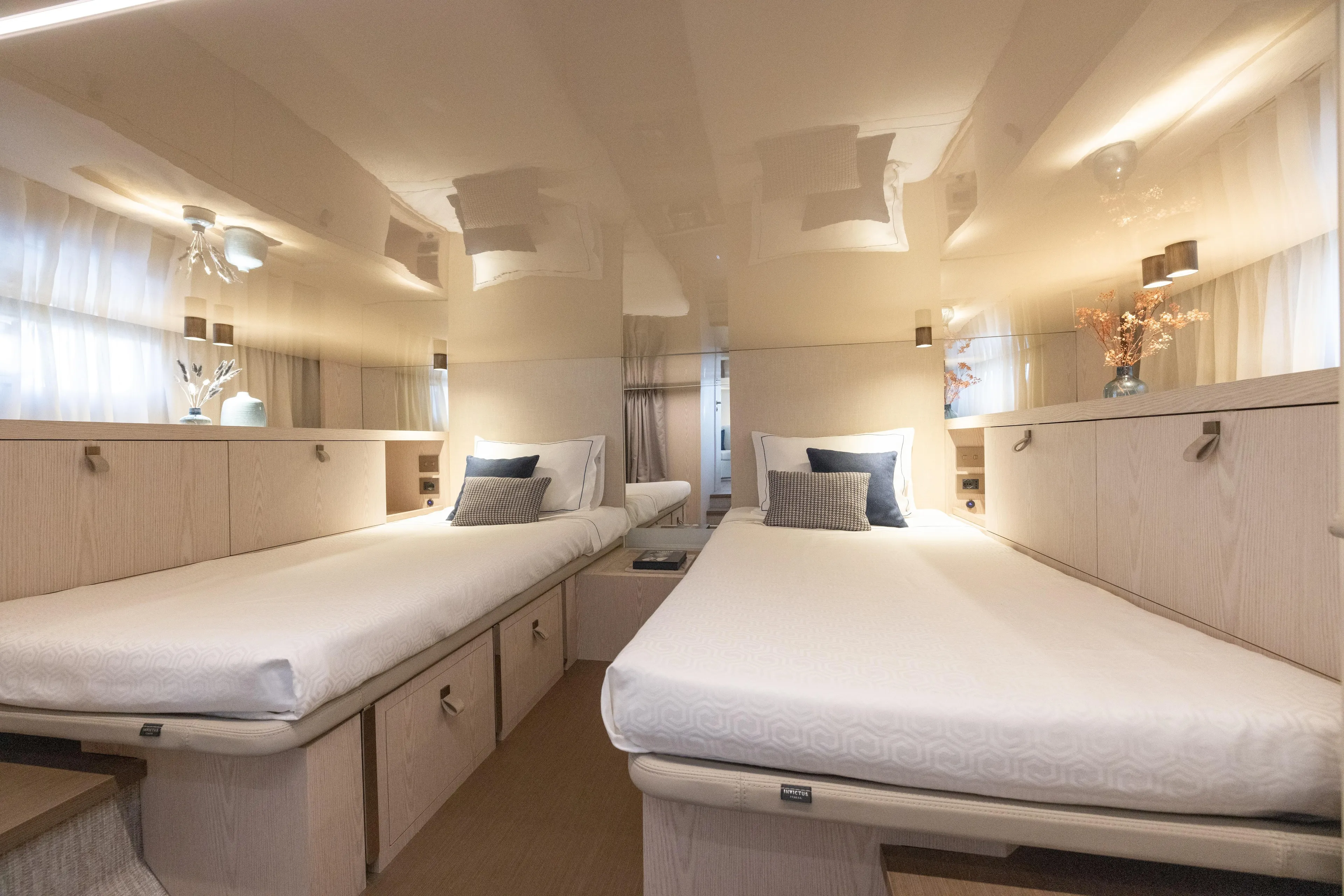  Yacht Photos Pics Luxurious twin cabin interior of 2026 Invictus TT460 yacht, featuring elegant decor and modern amenities.