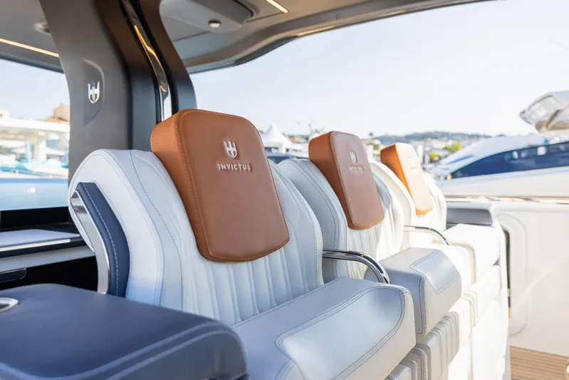  Yacht Photos Pics Luxurious seating on the 2026 Invictus TT460 yacht, featuring elegant leather headrests.