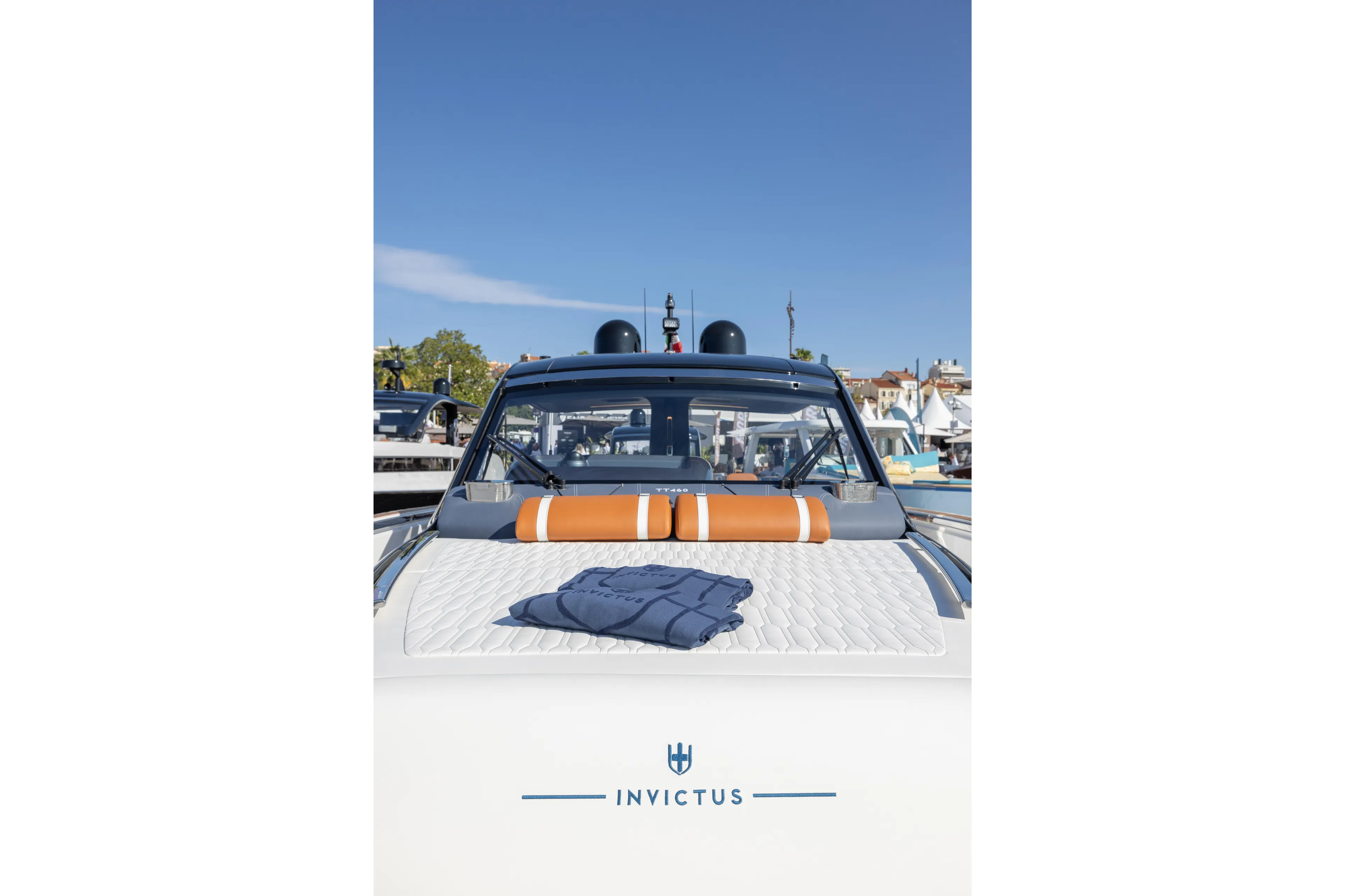  Yacht Photos Pics Invictus TT460 yacht, 2026 model, docked with luxurious deck and clear blue sky.