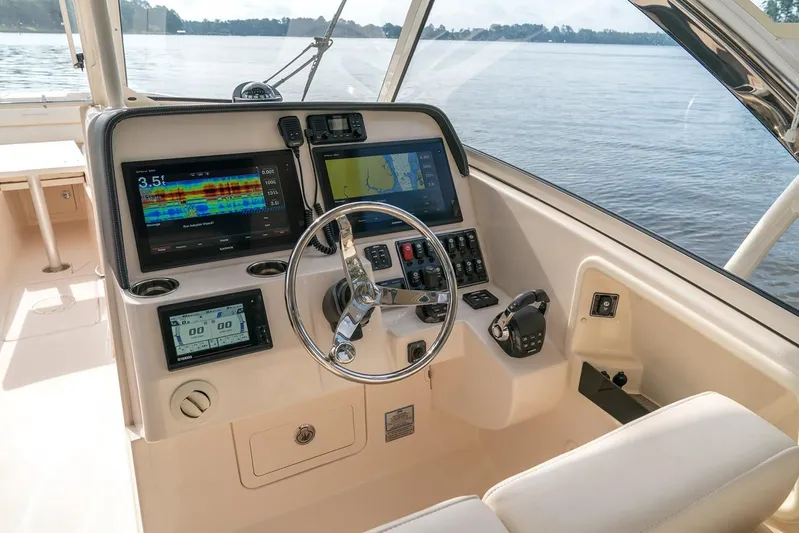  Yacht Photos Pics Grady-White Freedom 325 helm, 2018 model, featuring advanced navigation systems.