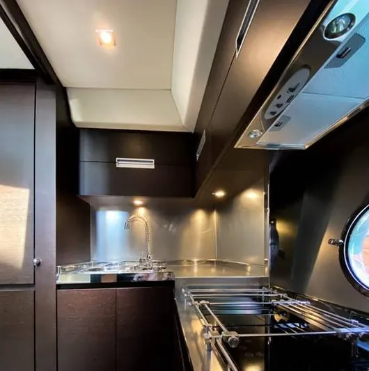  Yacht Photos Pics Luxurious kitchen interior of 2008 Azimut 62S yacht with modern appliances.