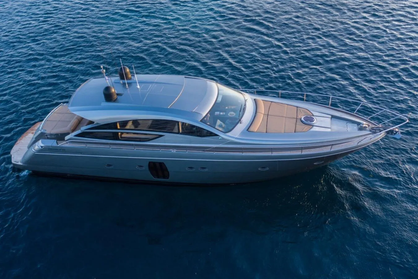 2008 Pershing 64' yacht cruising on open water, showcasing sleek design and luxury features.