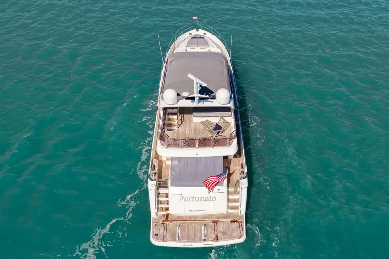 Fortunato Yacht Photos Pics Aerial view of 2014 Princess Y72 yacht on turquoise water.