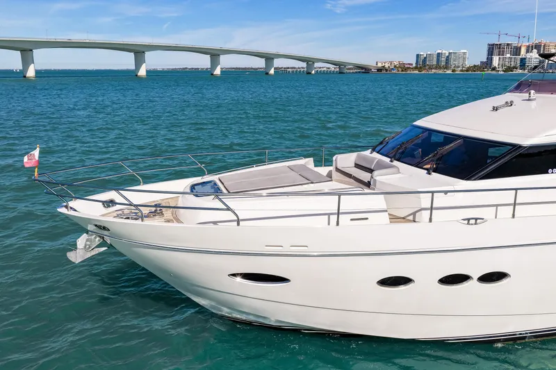 Fortunato Yacht Photos Pics Luxurious 2014 Princess Y72 yacht cruising near a scenic bridge and city skyline.
